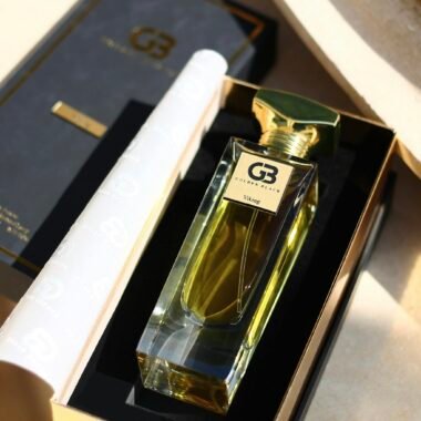 Luxurious Golden Black perfume bottle in sleek package design, elegant and fragrant.